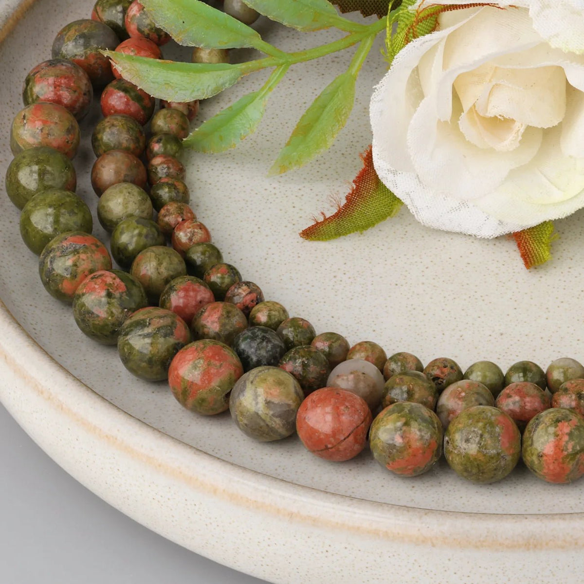 Unakit – Stein der Balance - PerlineBeads SA