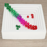 Doppelkegel aus Glas ⋅ 6 mm ⋅ Forest Bloom - PerlineBeads SA