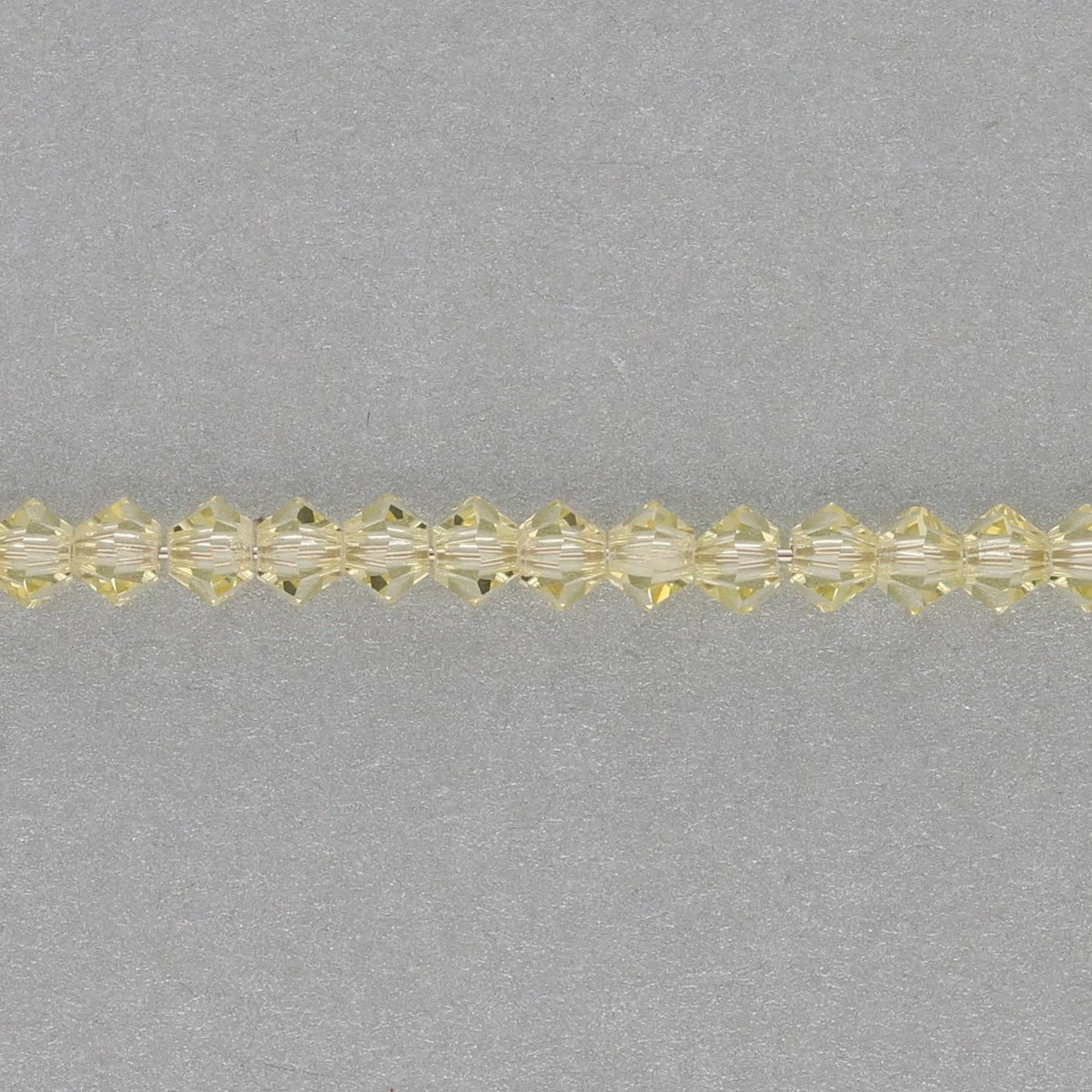 M.C. Doppelkegel 3 mm - Jonquil - PerlineBeads SA