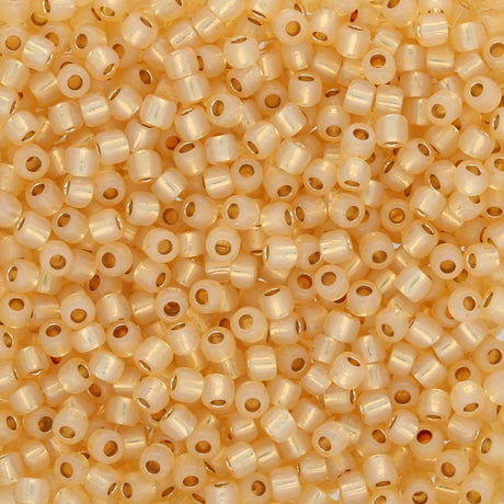 Rocailles - Perlen Toho 11/0 – PermaFinish - Silver - Lined Milky Light Topaz - PerlineBeads SA