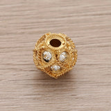Runde Metallperle 10 mm vergoldet mit 15 Swarovski® Kristalle - PerlineBeads SA