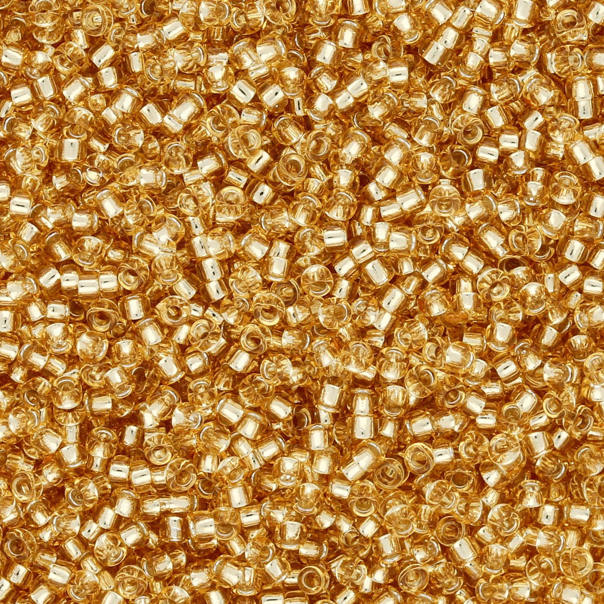Rocailles-Perlen Toho 15/0 – Silver-Lined Light Topaz - PerlineBeads