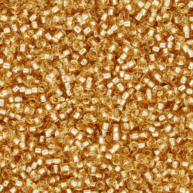 Rocailles-Perlen Toho 15/0 – Silver-Lined Light Topaz - PerlineBeads
