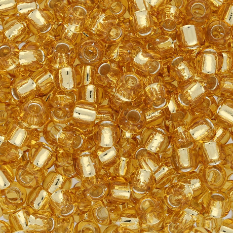 Rocailles-Perlen Toho 6/0 – Silver Lined Light Topaz - PerlineBeads