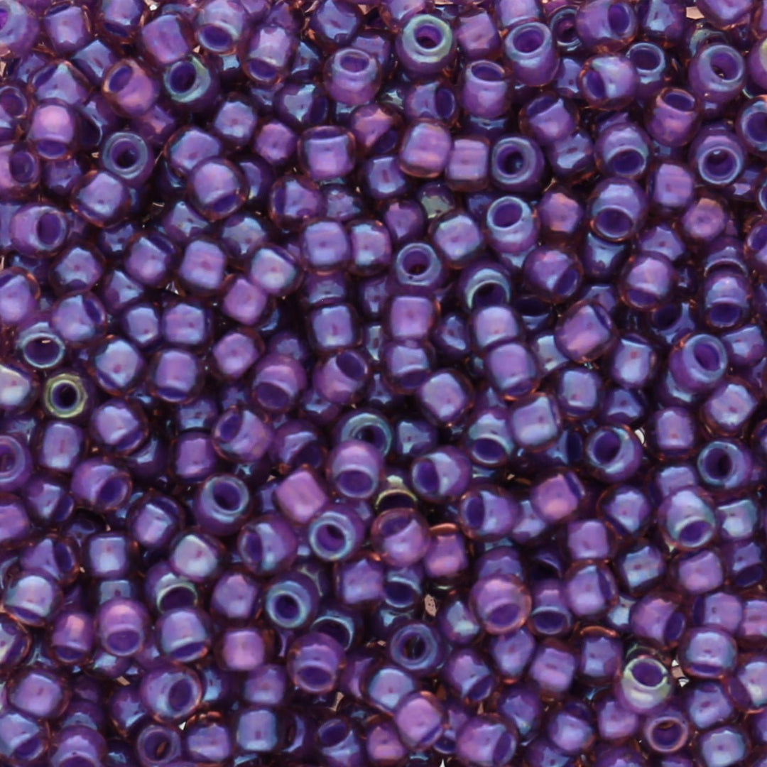 Rocailles-Perlen Toho 8/0 – Inside Color Rainbow Rosaline/Opaque Purple-Lined - PerlineBeads