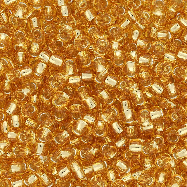 Rocailles-Perlen Toho 8/0 – Silver-Lined Light Topaz - PerlineBeads